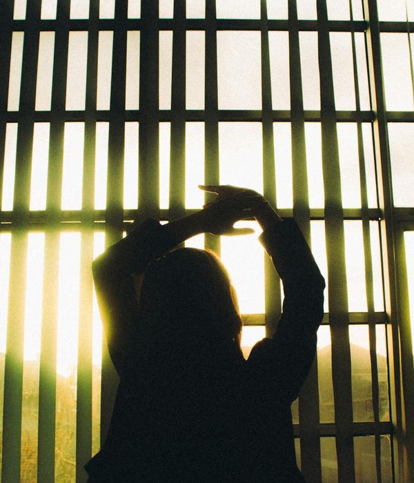 Woman in a calm yoga pose, embodying body harmony and peace.